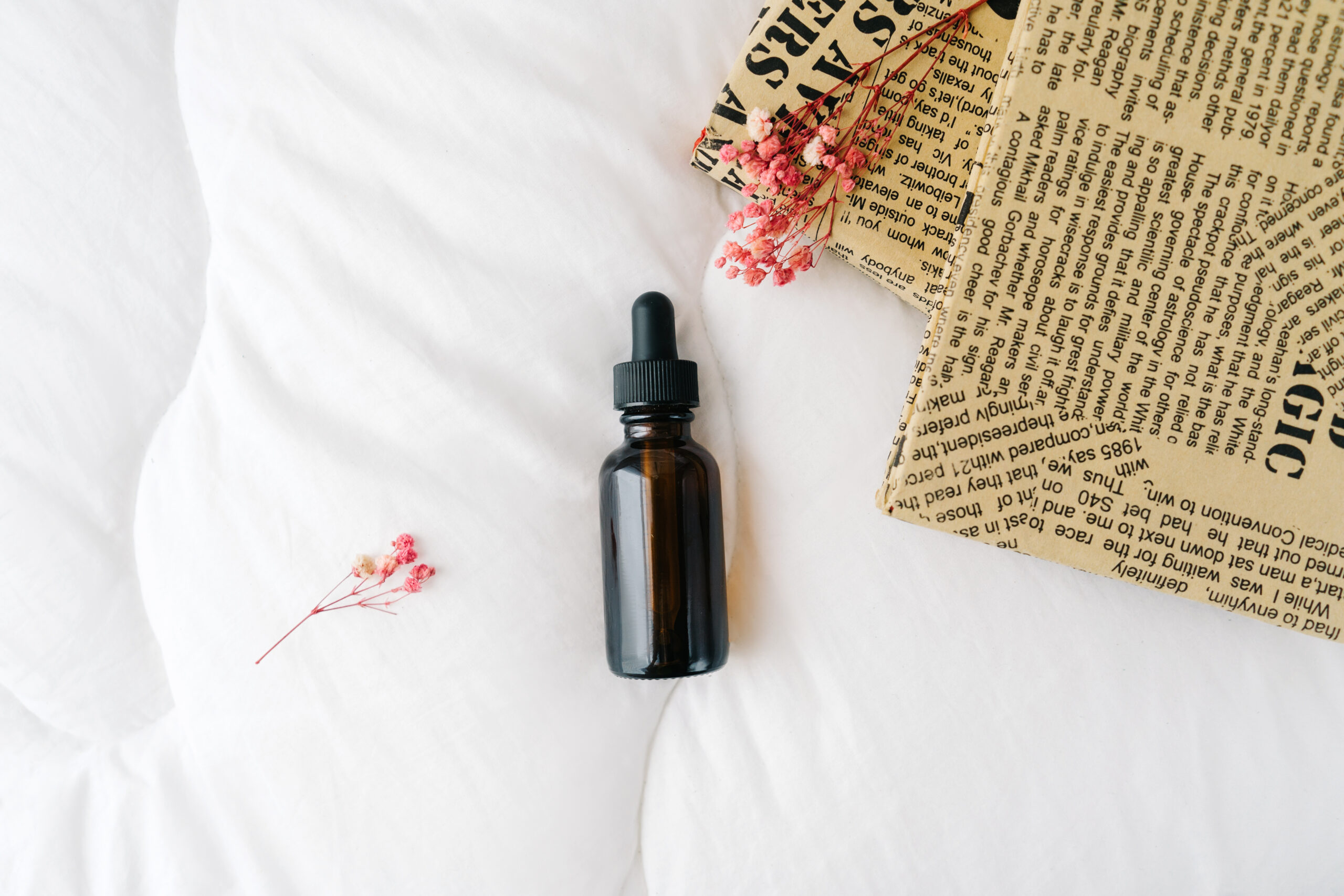 Blank amber face serrum bottle on white.